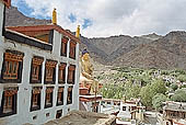 Ladakh - Hemis Gompa, the main monastery halls with the characteristc red painted windows and woden balconies on white washed faades 